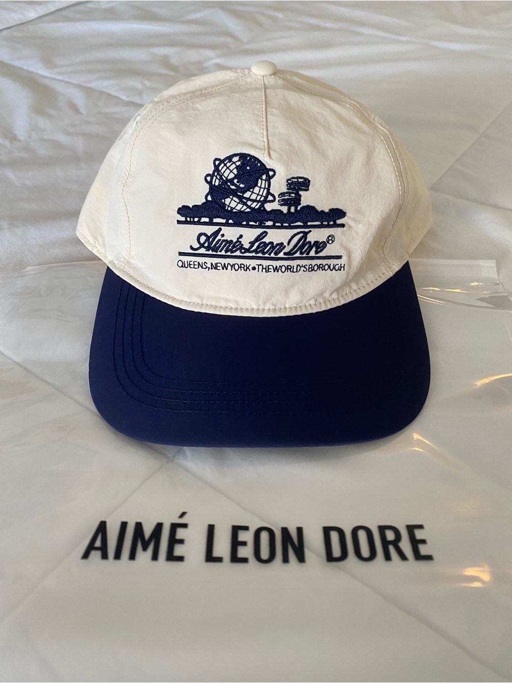 SS25 Aime Leon Dore Unisphere hat in Pristine White & Navy Blue
